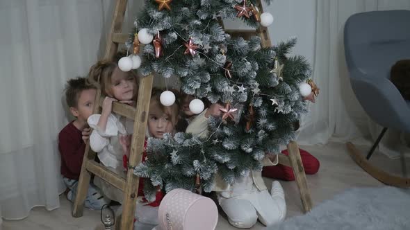 A group of children with New Year's gifts, happy friends for Christmas