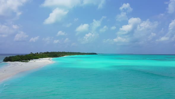 Luxury birds eye travel shot of a sunshine white sandy paradise beach and aqua blue water background