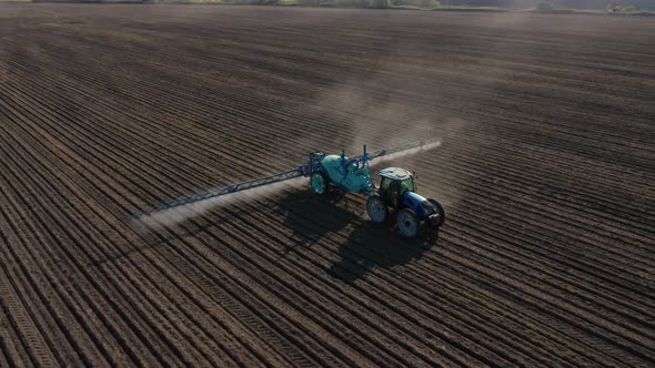 Aerial view of a tractor that irrigates agricultural field