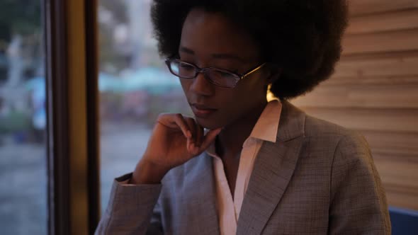 Successful Business Lady Sitting at Cafe