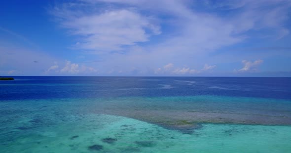 Daytime drone island view of a paradise sunny white sand beach and aqua turquoise water background 