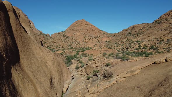 Stunning nature of Africa, aerial footage of a massive rocky mountain, Namibia