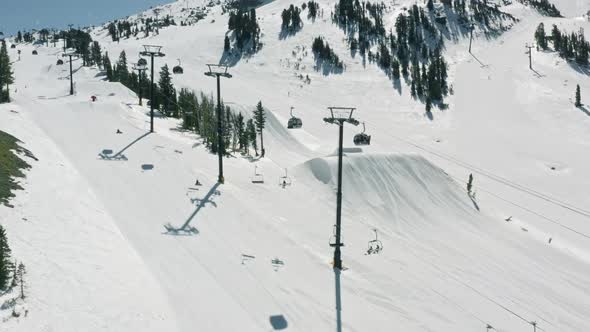 Soft Snow Flakes Falling on Ski Chairs at Mammoth Mountain Resort on Winter Day