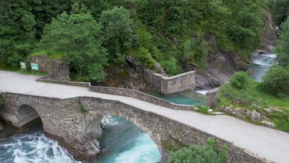 Scenery of bridge over fast river in highlands