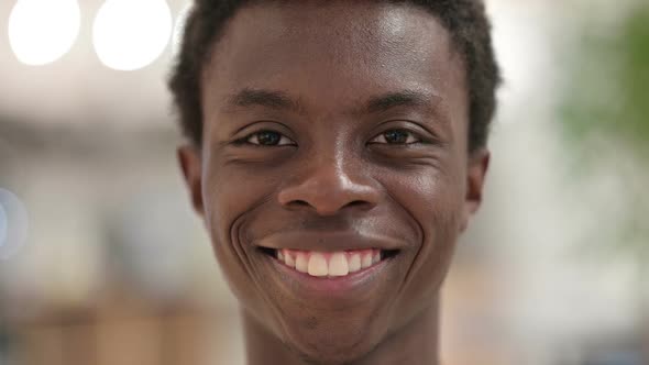 Close Up of Smiling Young African Man Face