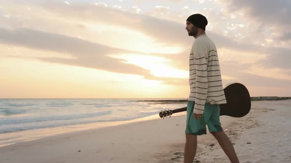 Young Beautiful Man Walk and Relax on Ocean Beach Seaside at Sunrise or Sunset in Summer Gimbal