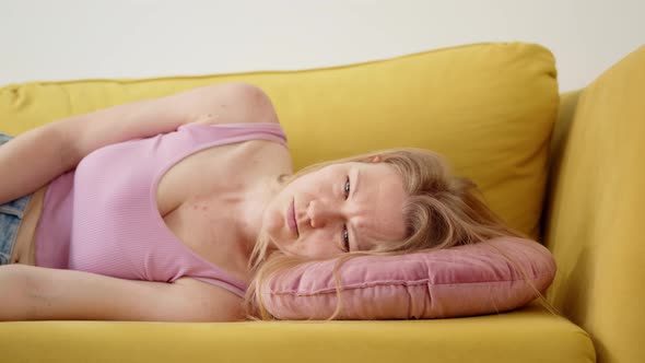 Tired Beautiful Blonde Falls on Pillow Upset and Angry