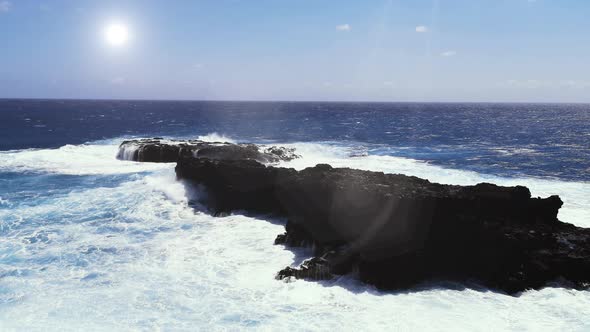 Waves Splashing against the Volcanic Rock in Rapa Nui Island, Easter Island, Chile.