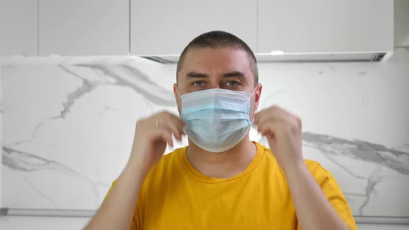 Man Wearing Medical Mask Pray and Stay at Home. Covid-19 Quarantine