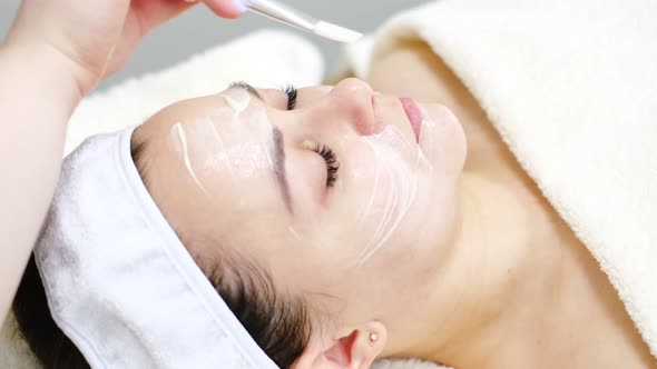 Beautician Doctor Making Skincare Procedure in Beauty Salon Portrait of Girl Closeup