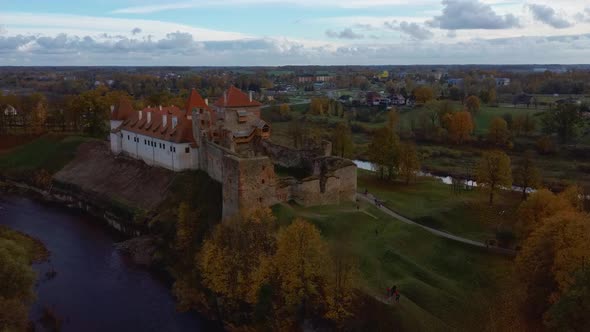 Bauska Medieval Castle Ruins Complex and Park From Above Aerial Shot 4K Video