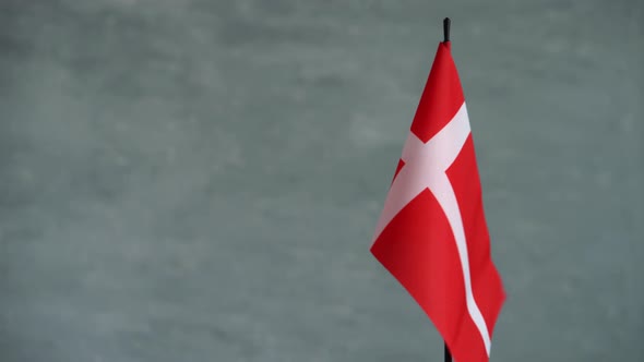 State Flag of Kingdom of Denmark Waving on Gray Background