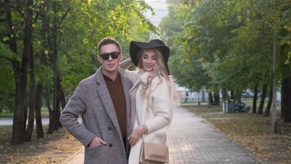 Married Couple Together Stand on the Street in the Park