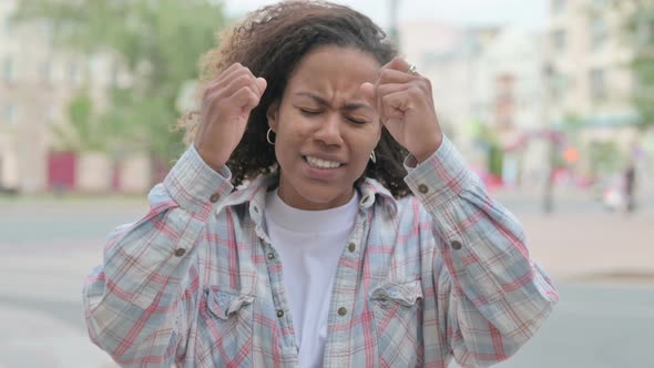 Portrait of Disappointed African Woman Reacting to Loss Outdoor