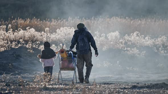 Back View of Survivor Father and Daughter in Gas Mask Going Through Clouds of Toxic Smoke.