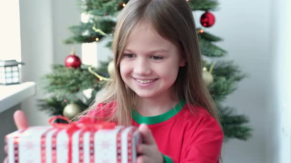 Little Girl Runs Into the Room and Finds a Gift From Santa on Christmas Morning