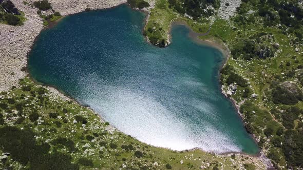 Aerial View of a Lake in the Pirin Mountains with Blue Clear Water