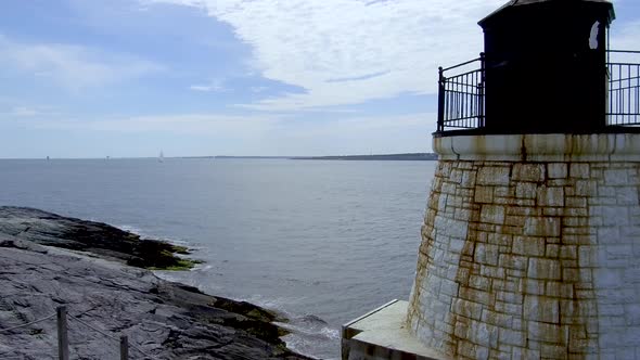 A small lighthouse near Newport Rhode Island looking out into the entrance of the bay.