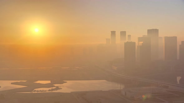 Abu Dhabi City Skyline with Skyscrapers at Sunrise From Above Timelapse