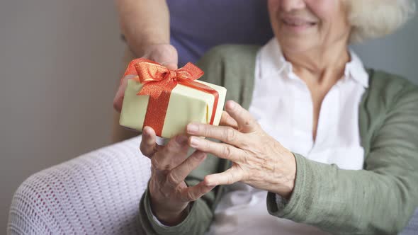 an Elderly Woman Is Delighted with Her Husband's Gift