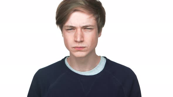 Portrait of Young Aggressive Teen Looking on Someone Showing I'm Watching you with Fingers Squinting