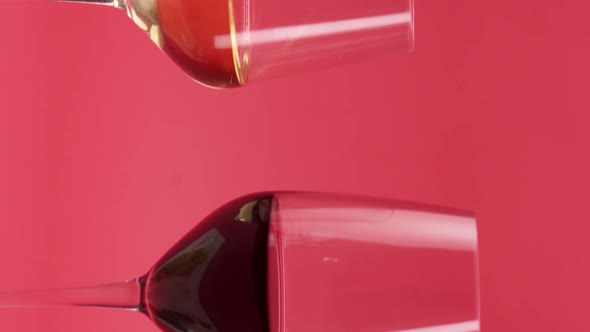 Vertical video, Close-up: red wine is poured into a glass