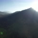Aerial landscape view of the sun is shining through the greenery rainforest mountains by drone - VideoHive Item for Sale