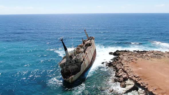 Flying Over Coastline with Broken Ship