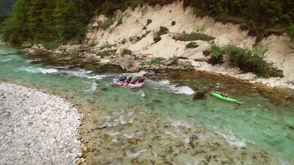 Aerial view of a group of people rafting on the Soca river, Slovenia.