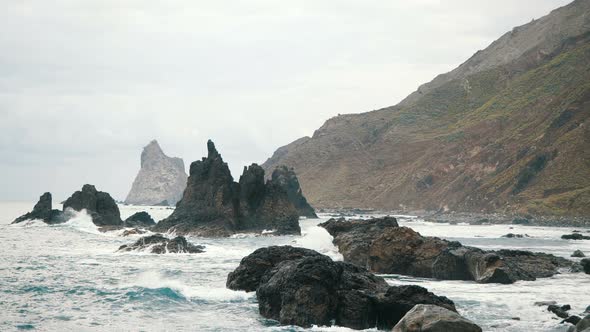 Big Waves Are Crashing on Rocks and Spraying. Slow Motion