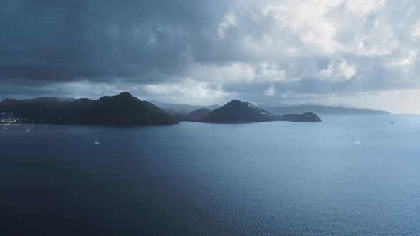Aerial footage of drone approaching the dark mountains (Rodney Bay, Saint Lucia)