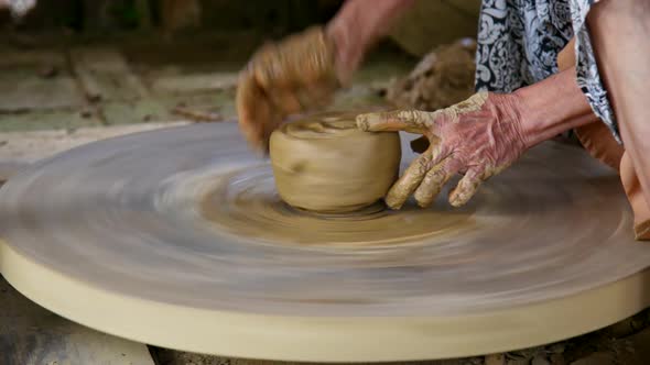 Woman Rotates Wheel By Foot Potter Makes Next Clay Pot