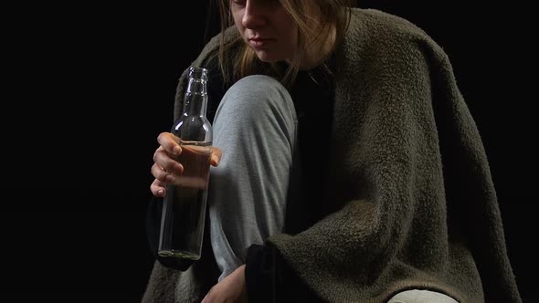 Depressed Woman Drinking Vodka With Disgust, Misery and Hopelessness, Addiction