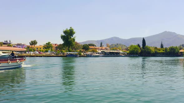 Inspection of the Banks of the River Dalyan with Moored Boats and Mountain Landscapes