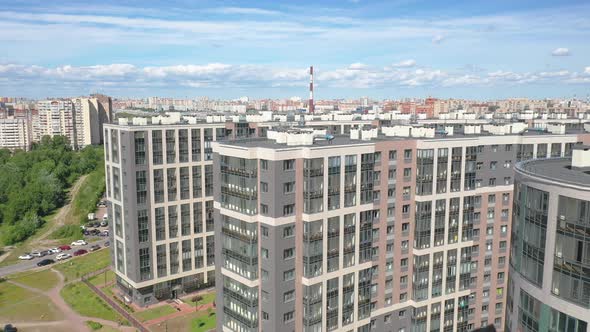 Aerial Drone Pull-Out shot of a residential building compound next to the Western High-Speed Diamete