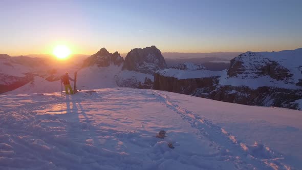 Downhill skier standing on top of mountain, Dolomites, Italy