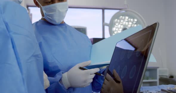 Medical professionals working at a hospital alt