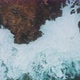 Drone zooming out above ocean coastal caves - VideoHive Item for Sale