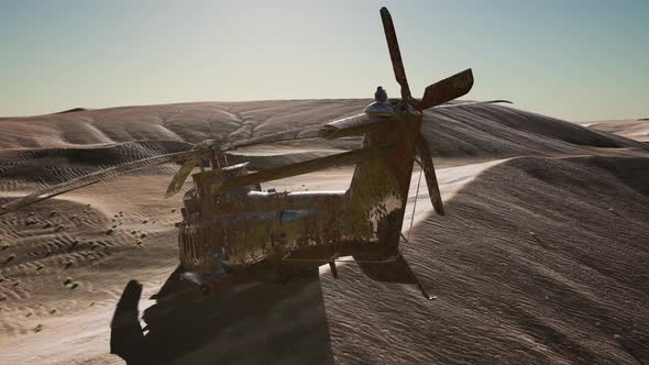 Old Rusted Military Helicopter in the Desert at Sunset alt
