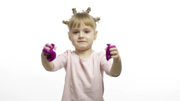 Kid Playing with Hand Made Toy Slime. Child Having Fun Making Purple Slime