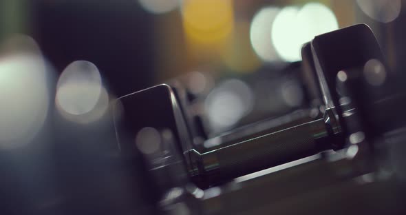 Row of Dumbbell in the Gym, Take a Dumbbell with Hand. Close-up.