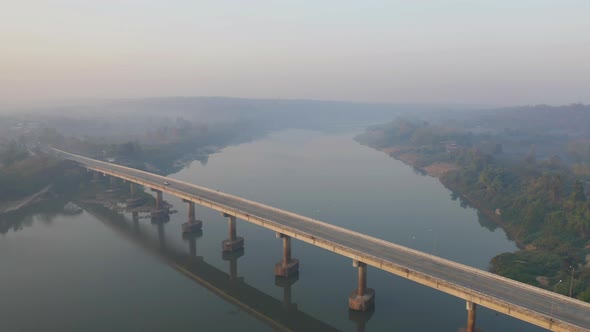 Aerial view of Mekong River with green mountain hill and mist fog. Nature landscape background