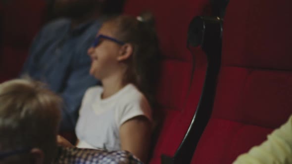 Kids Laughing in Movie Theatre