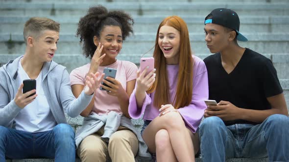 Excited Teen Girl Showing Friends Smartphone Screen, Happy Lottery Winner