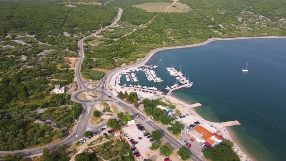 Aerial drone footage of the medieval Krk old and and marina in Krk island in the Adriatic sea in Cro