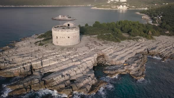 Yellow tent with family and Amazing view on  azure Adriatic sea and rocky shore