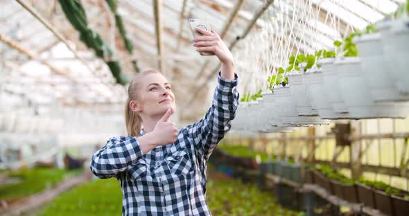 Young Female Environmentalist Taking Selfie