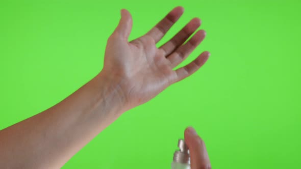 Parfum bottle  spray applying on the hand in front of green screen 4K 3840X2160 UltraHD footage - Pa