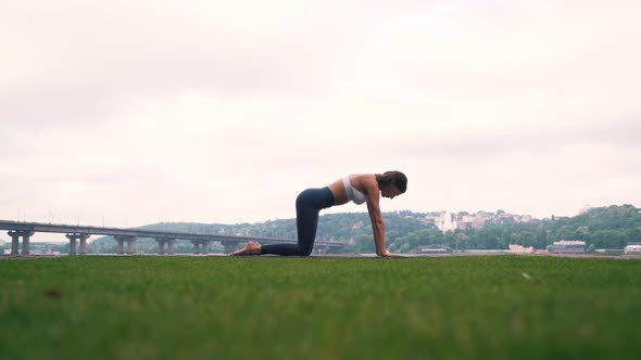 Girl Doing Fitness Exercises Otdoors in City