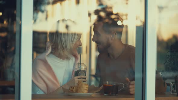 Young couple having breakfast